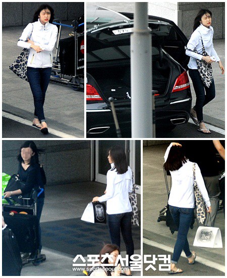 김연아가 15일 중국 상하이에서 열리는 아이스쇼에 참가하기 위해 인천국제공항을 통해 출국하고 있다. 김연아는 황상민 교수의 교생쇼 발언으로 불거진 논란을 의식한듯 취재진의 눈에 안 띄는 조용한 출국을 택했다. /인천국제공항= 노시훈 기자