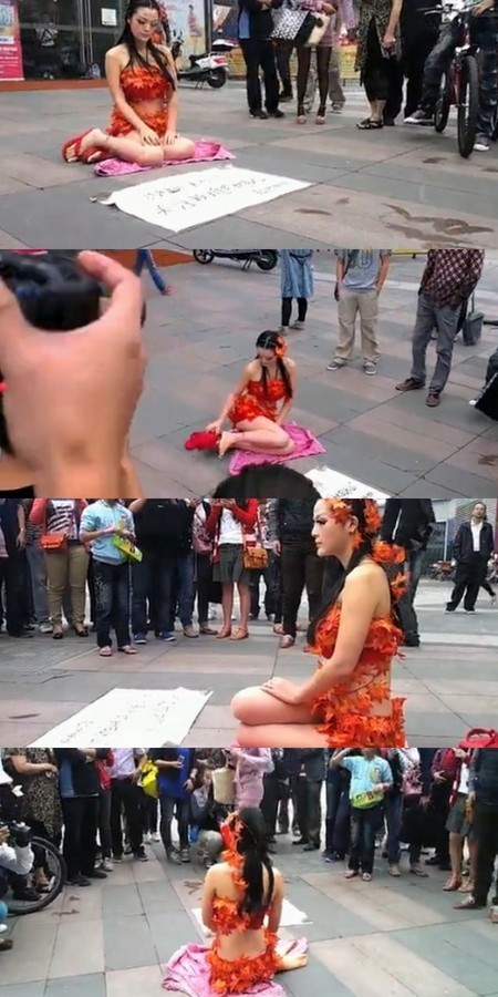 청두시 번화가에 등장한 낙엽녀가 지구온난화에 대한 관심을 호소하고 있다./시나닷컴 영상 캡처