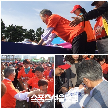 마라톤을 함께 뛸 수 없었던 민주통합당 문재인 대선 후보는 참가자들과 악수를 나누며 아쉬움을 달랬다.