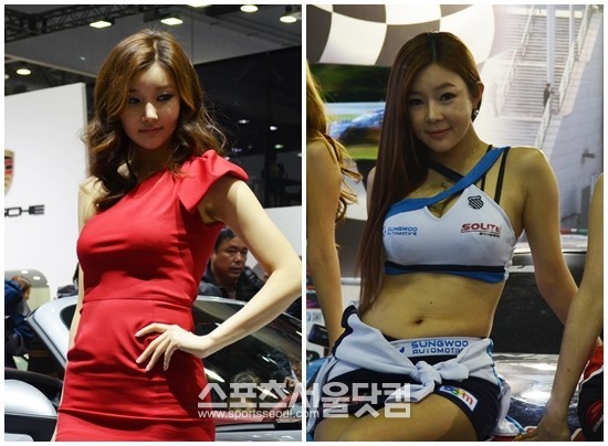 30일 2013 서울모터쇼에서 레이싱 모델들이 차량 옆에서 섹시한 포즈를 취하고 있다.