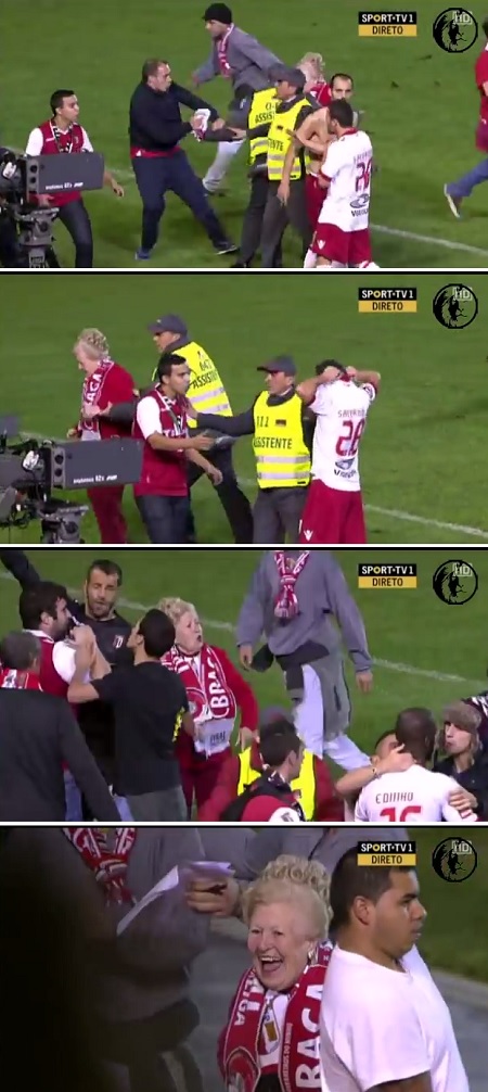 스포르팅 브라가 중년 여성 팬이 지난 20일 배레이오스 스타디움에서 열린 2013~2014시즌 포르투갈 프리메라리가 14라운드 마리티모와 원정 경기에서 경기장 난입하려다가 제지당하고 있다. / 유튜브 영상 캡처