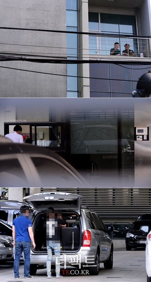 YG 소속사 관계자들이 여느 때처럼 행동하며 편안한 분위기를 풍기고 있다./김슬기 기자