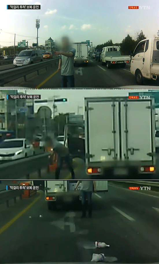 도로 위는 무법지대? 탑차 운전자가 욕설을 내뱉으며 도로에 막걸리병을 던지고 있다. /YTN뉴스 영상 갈무리