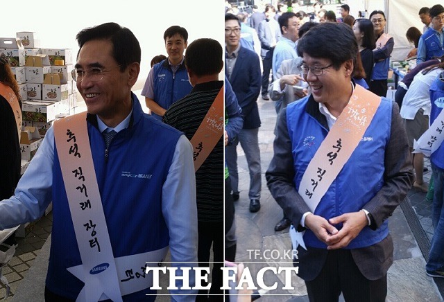 안민수 삼성화재 사장(왼쪽), 박동건 삼성디스플레이 사장 등도 일일점장을 자처하며 지역 특산물 판매를 위해 팔을 걷어붙였다. / 서재근 기자