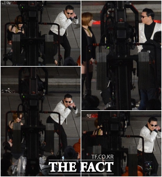 가인과 싸이가 열정적인 춤 동작을 펼치고 있다.