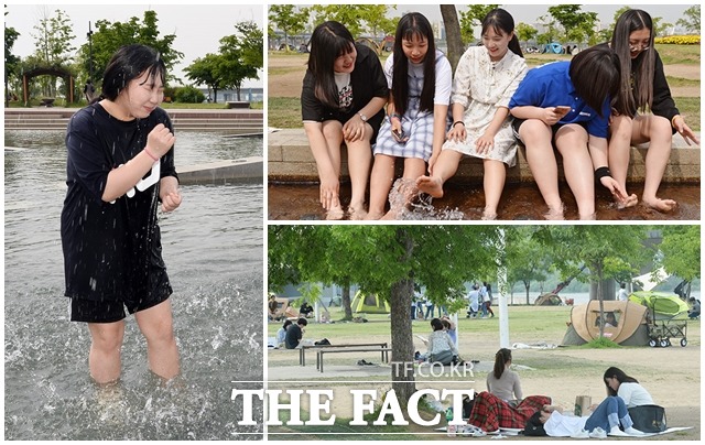 낮 최고기온이 30도까지 올라 올해 들어 가장 무더운 날씨를 보인 15일 오후 서울 영등포구 여의도 한강공원을 찾은 시민들이 더위를 피해 휴식을 취하고 있다. /이동률 인턴기자