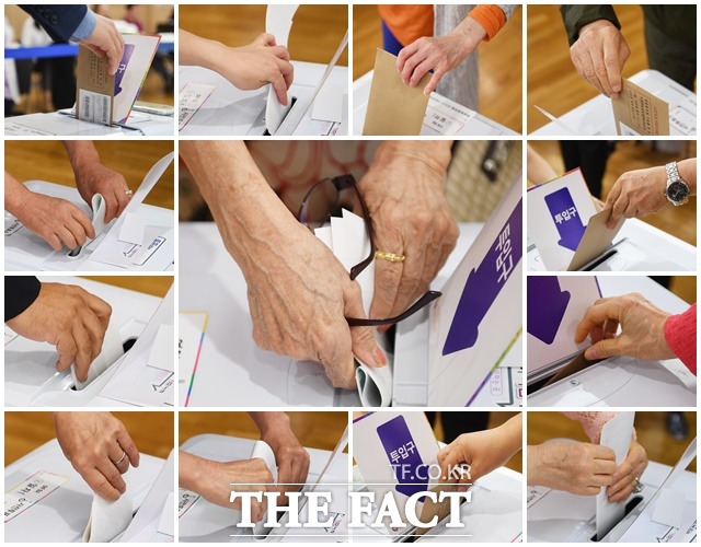 6·13 지방선거 사전투표 첫날인 8일 오전 여의동주민센터에 마련된 사전투표소에서 유권자들이 투표를 하고 있다. / 배정한 기자