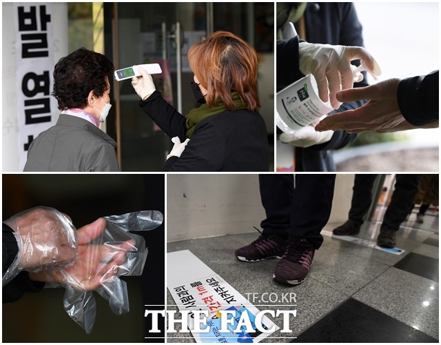 제21대 국회의원 선거일인 15일 오전 유권자들이 서울 종로구 구기동 하비에르 국제학교에 마련된 투표소에 들어가기 전 발열 검사와 손 소독, 비닐장갑 착용, 사회적 거리두기를 실행하고 있다./남용희 기자