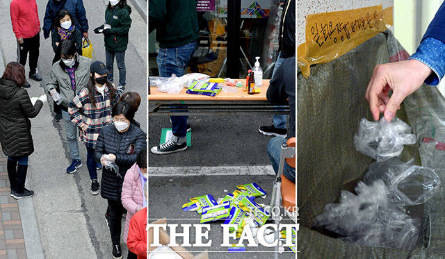 제21대 국회의원 선거일인 15일 서울 노원구와 광진구에 마련된 투표소에서 유권자들이 방역 지침을 지키기 위해 일회용 비닐 장갑을 사용한 후 버리고 있다. /이선화 기자