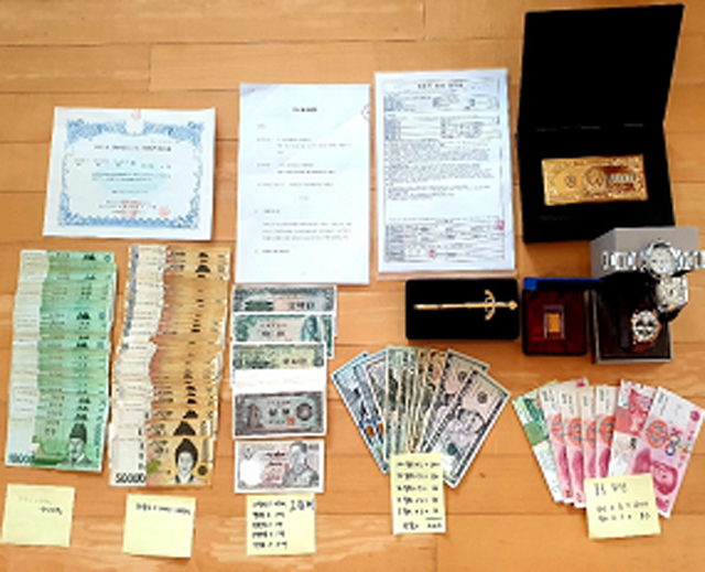 국세청이 재산이 있으면서도 거액 세금을 장기간 납부하지 않는 악의적 고액 체납자 812명에 대한 동시 추적 조사에 착수한다. 사진은 국세청이 변호사 A 씨로부터 압류한 2억 원 상당의 현금과 물품. /국세청 제공