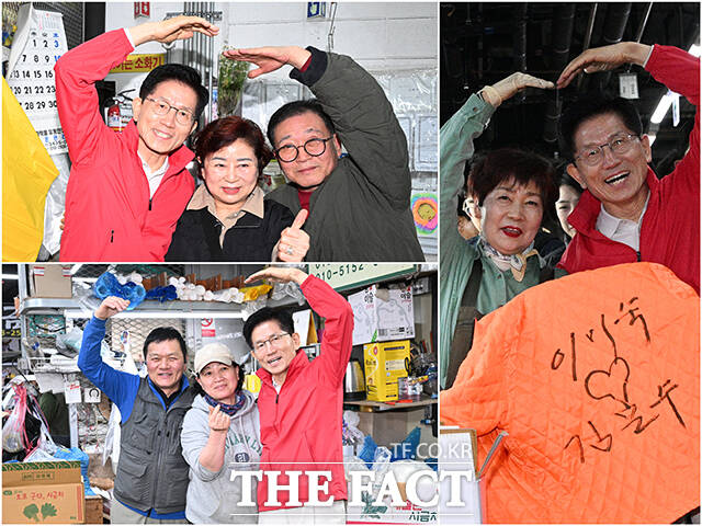 김문수 국민의힘 대선 후보가 12일 오전 서울 송파구 가락시장을 찾아 상인들과 기념촬영을 하고 있다. /박헌우 기자