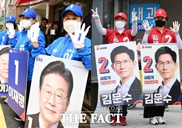 제21대 대통령선거를 11일 앞둔 23일 서울 도봉구 일대에서 이재명 더불어민주당 대선 후보(왼쪽)와 김문수 국민의힘 대선 후보 선거유세원들이 유세를 하고 있다. /이새롬 기자