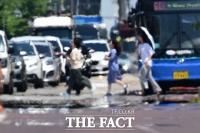  팔팔 끓는 아스팔트 [포토]