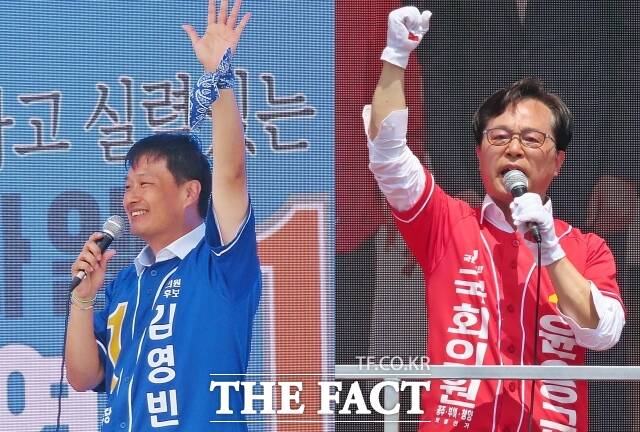 김영빈 더불어민주당 국회의원 후보(왼쪽)와 윤용근 국민의힘 후보가 1일 각각 중동사거리와 산성시장 앞에서 집중유세를 펼치고 있다. /김형중 기자